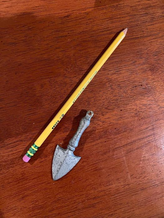 I found an old, finger-sized thing in an old house; does anyone know what it might be? Almost looks like a tiny shovel.